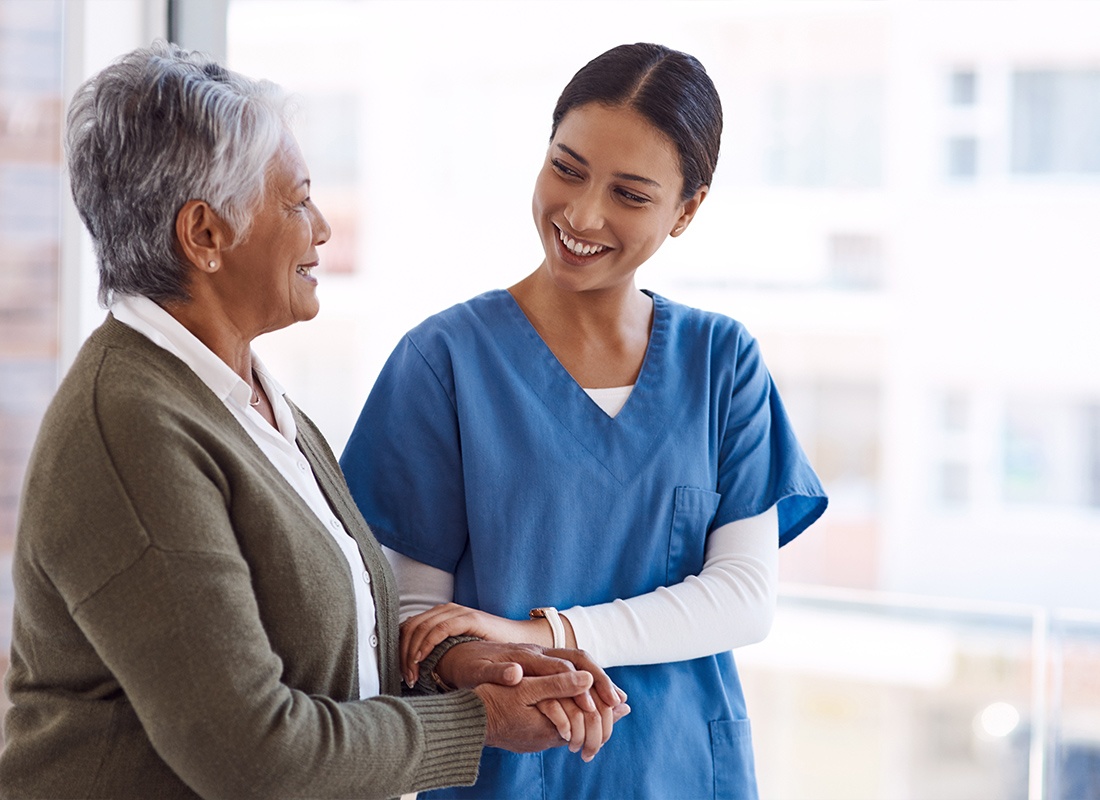 Medicare - Young Healthcare Worker Helping a Senior